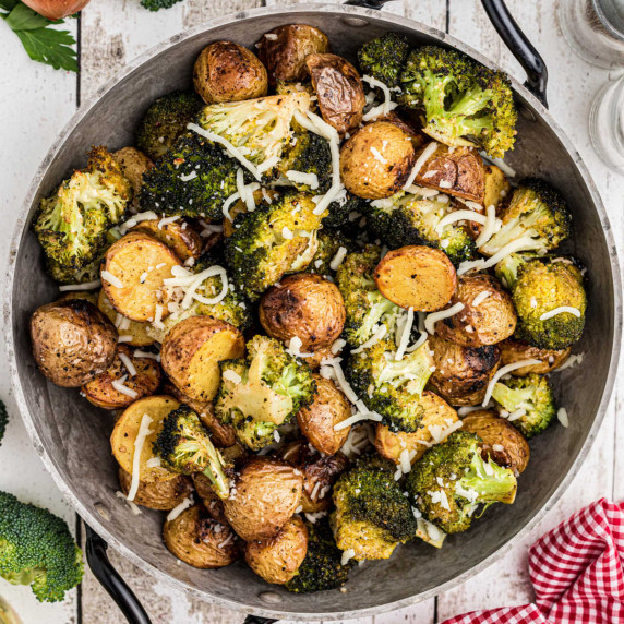A pan full of roasted potatoes and broccoli.