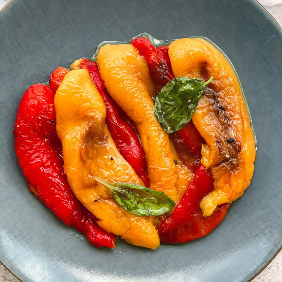 Peppers roasted on a blue plate