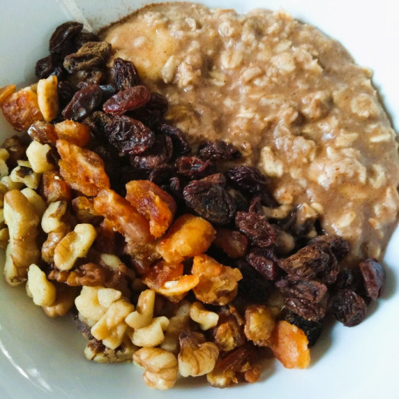 cinnamon spiced oatmeal with raisins, dates, and walnuts