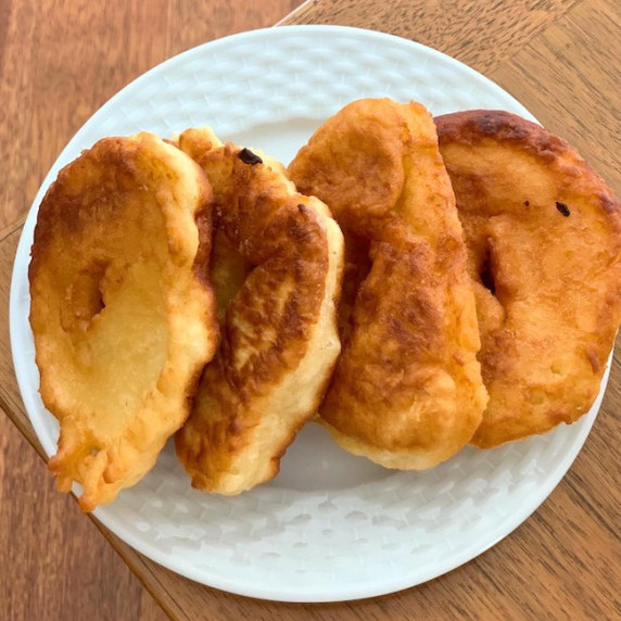 A plate full of savory fried breads prepared the Turkish style and called lokma or pişi.