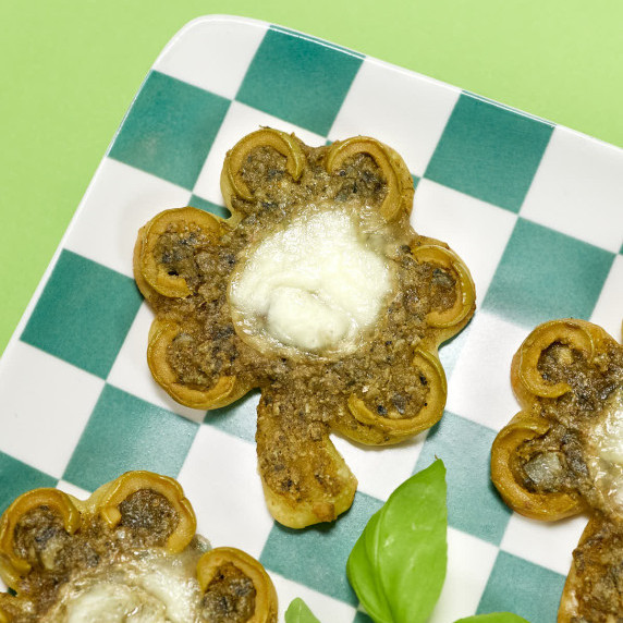 Shamrock shaped green pizza.