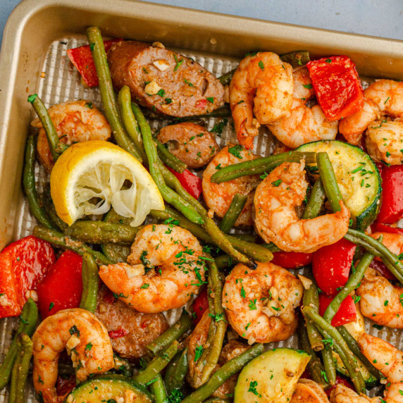 Close up overhead of a sheet pan Cajun shrimp and sausage recipe.