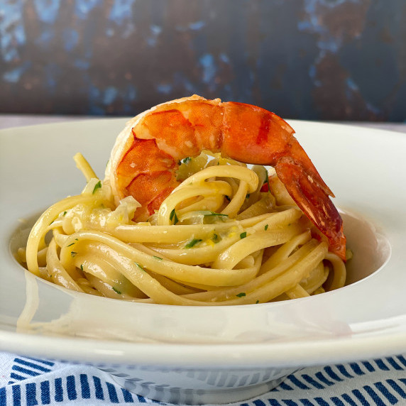 Swirl of Shrimp Scampi Pasta in a white plate