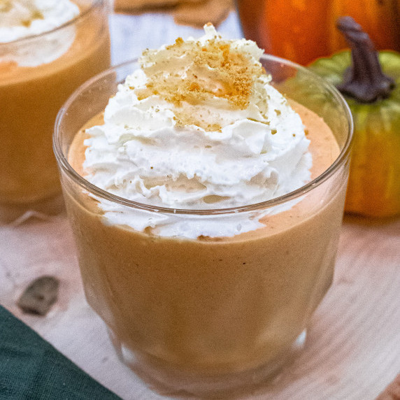 pumpkin cheesecake smoothie topped with whipped cream