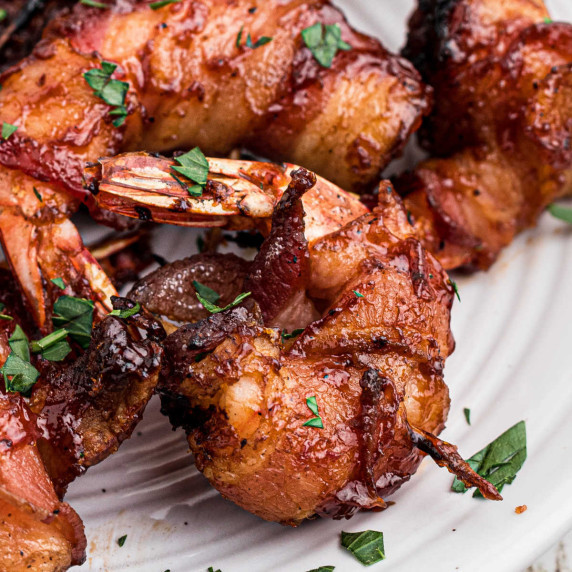 Close up of some smoked bacon wrapped shrimp.