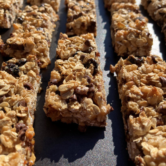 Granola bars on a black plate.