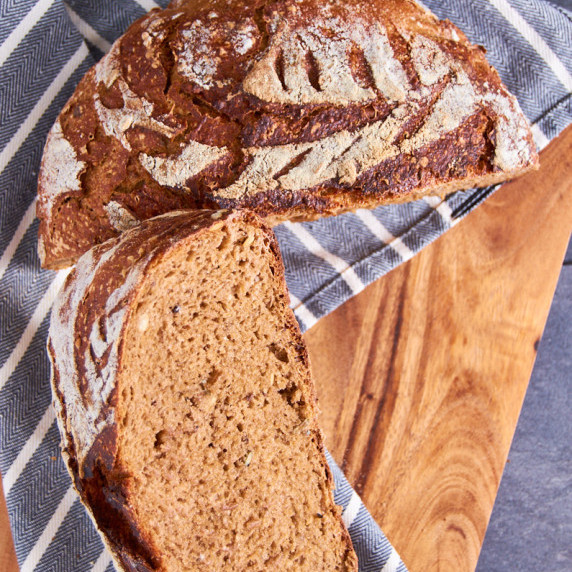 Large loaf of beautifully crusty, malty, and moist German Sourdough Rye Beer 
