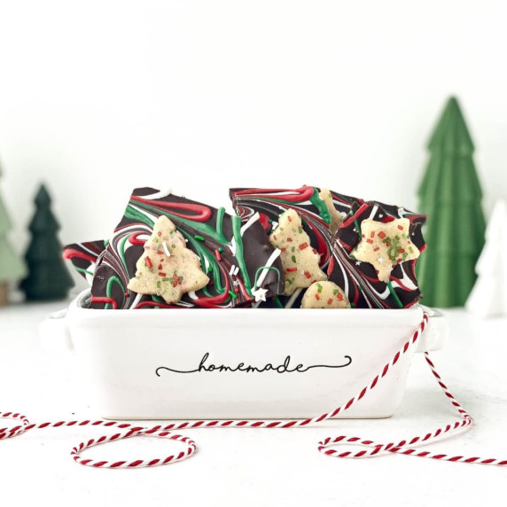 photo of pieces of sugar cookie dough bark in a small white container with 