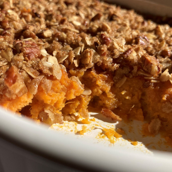 Sweet potato casserole in a white baking dish.