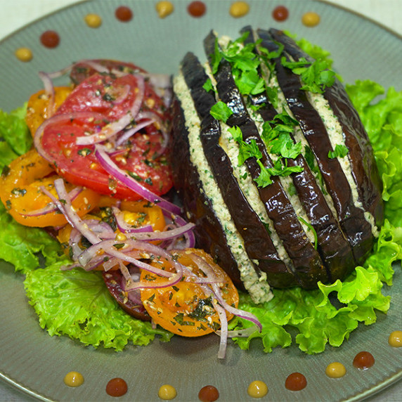 Stuffed eggplants with salad on a plate