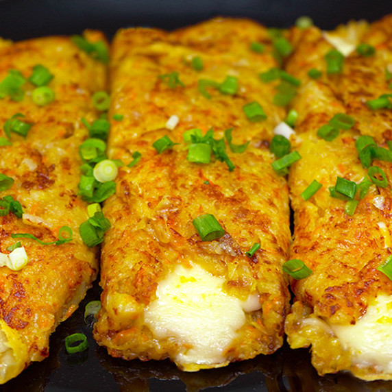 Potato pies with cheese on a plate.