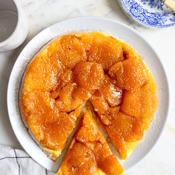 A delicious homemade Tarte Tatin, featuring caramelized apples on a golden, flaky shortcrust pastry.