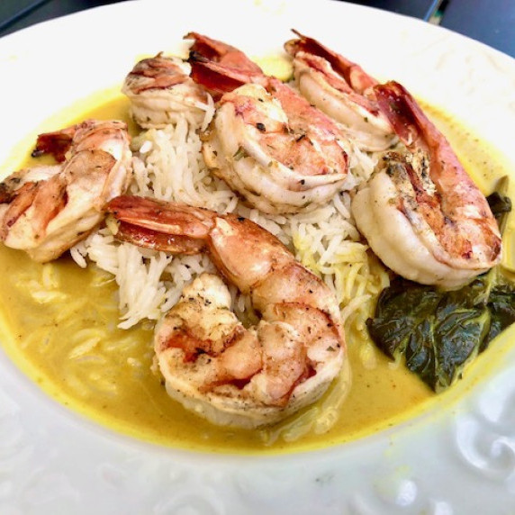 Marinated Shrimp Grilled and combined with rice and red curry sauce