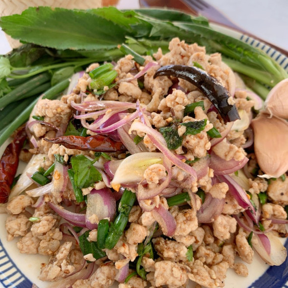 Close-up of Thai pork larb in a white dish.