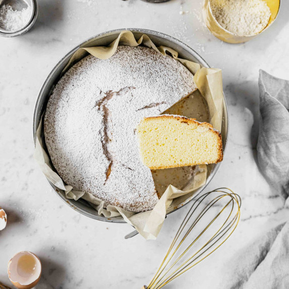 paradise cake with powdered sugar on top