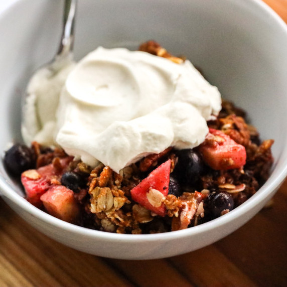 blackberry, blueberry, strawberry, and apple crisp with fresh homemade whipped cream