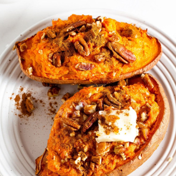 Twice Baked Sweet Potatoes topped with pecans and butter