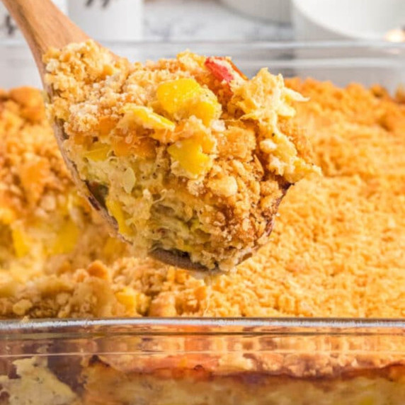Squash Casserole features grated Cheddar cheese, crumbled buttery crackers, and fresh yellow squash.