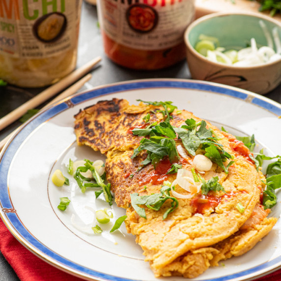 Chickpea flour omelet with garnish on a plate