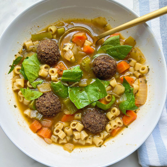 finished vegan italian wedding soup in a white bowl