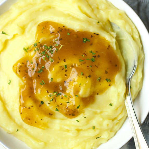 finished vegan mashed potatoes in a white bowl