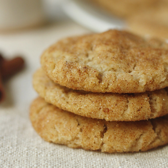 finished vegan snickerdoodle cookies stacked on a plate