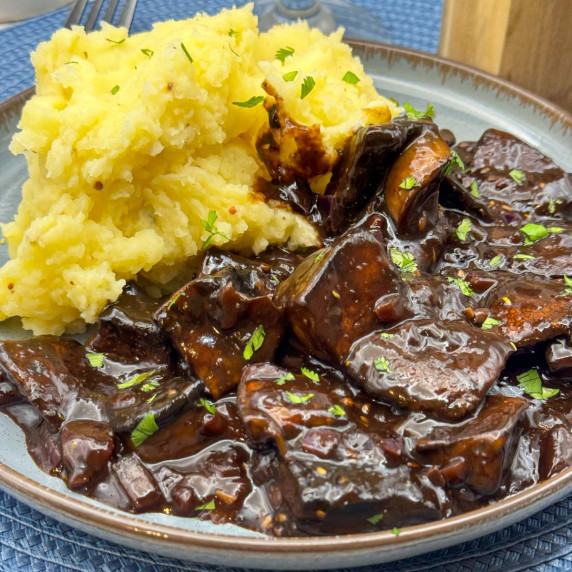 Vegan beef tips and gravy with mustard mashed potatoes