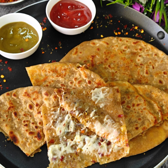 A crispy delicious easy to make stuffed cheese paratha. A perfect kids snack.
