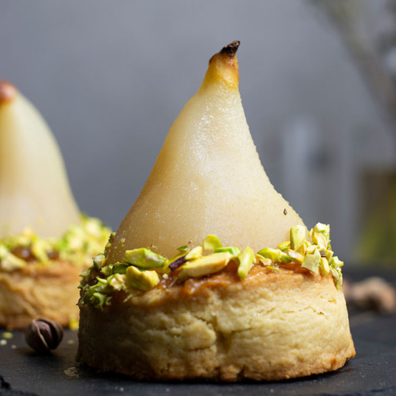 white wine poached pears with pistachio blondie