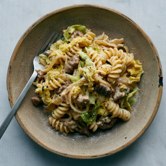 a bowl of Pasta With Sausage, Caramelized Cabbage and Goat Cheese