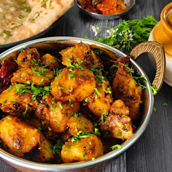An everyday easy potato recipe made with boiled potatoes tossed in aromatic spices. Vegan Recipe