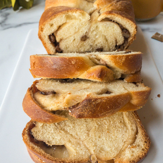 A sliced loaf of nutmeg and pecan bread.