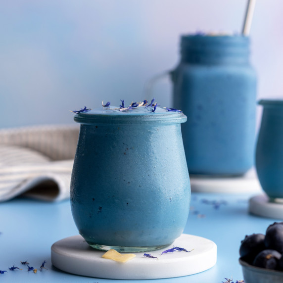 Blue spirulina smoothie in a small jar