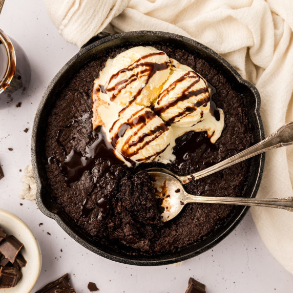 Brownie Skillet with scoops of ice cream and a drizzle of chocolate.