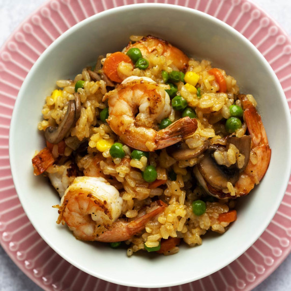 Cajun shrimp and rice pilaf in a bowl overhead shot