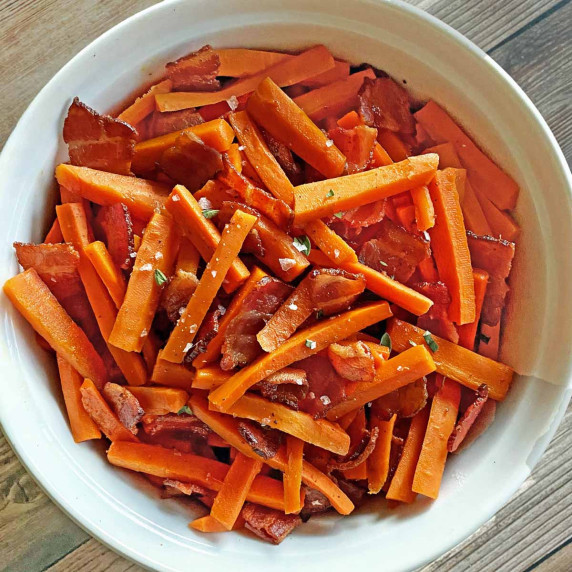 Maple Bacon Carrots in a white serving dish.