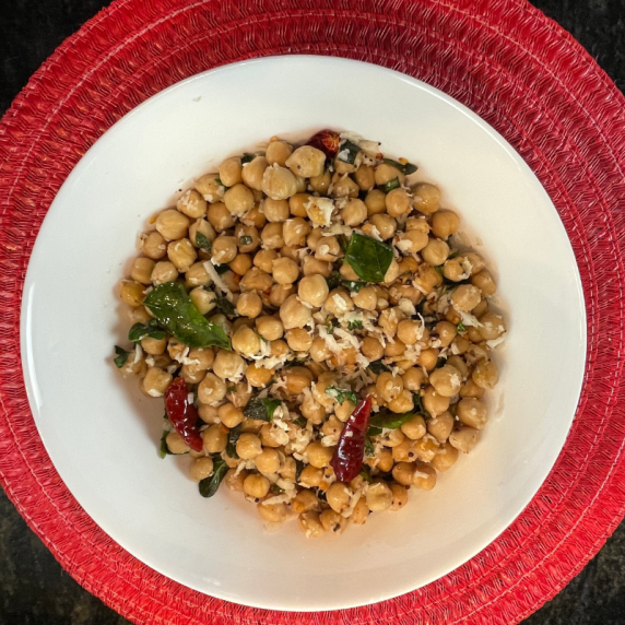 chana sundal chickpea salad  with coconut in white bowl