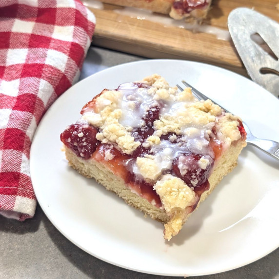 Cherry pie squares on a plate.