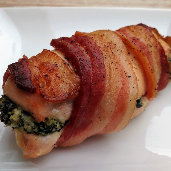 A chicken breast stuffed with goat cheese, spinach, and garlic, then wrapped in bacon.