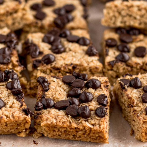 Chocolate chip flapjack squares on baking paper, ready to serve.