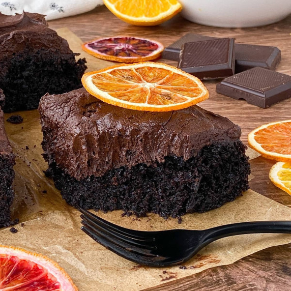 Slice of Chocolate Orange Cake with a bite missing.