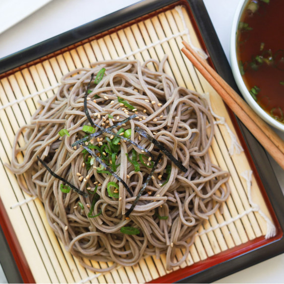Buckwheat noodles on a bamboo srainer. 