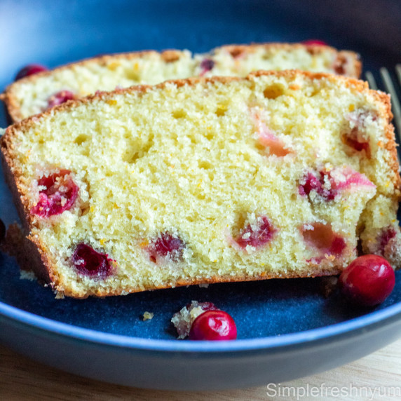 Cranberry Orange bread slices on a blue plate