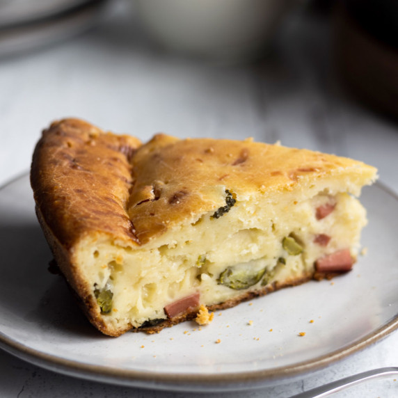 Crustless ham and cheese quiche piece in a plate