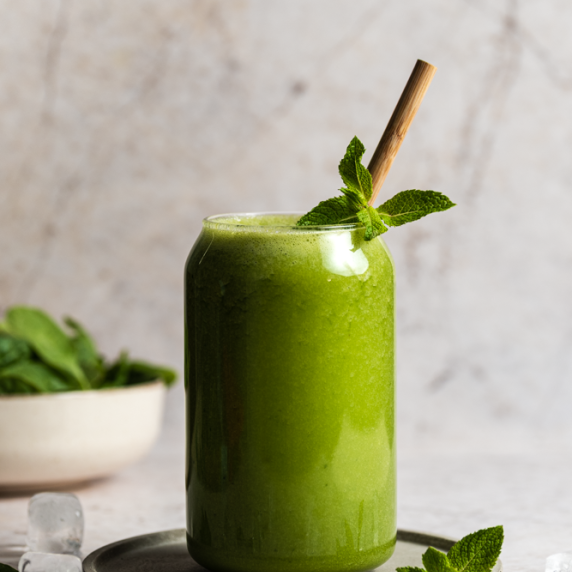 Hydrating Cucumber Mint Smoothie arranged in a aesthetic glass with bamboo straw