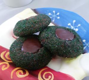 Dark chocolate mint thumbprints arranged on a holiday plate