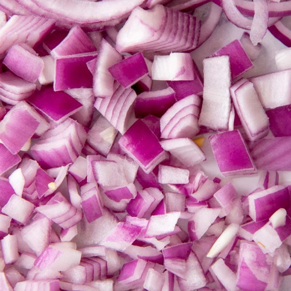 Close-up of sliced, chopped, diced, and minced red onion layered from top to bottom.