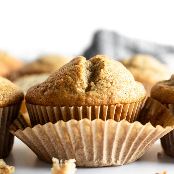 banana muffin in cupcake liner on table