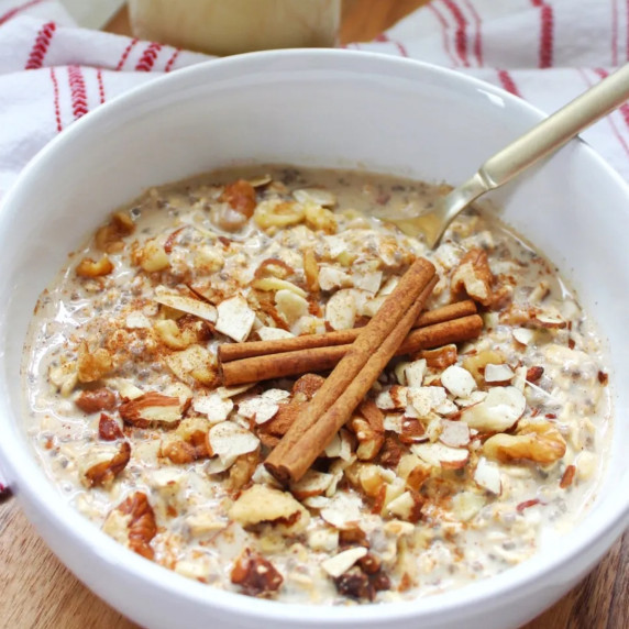 Eggnog overnight oats served in a white bowl. 