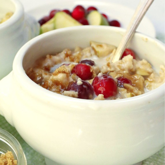 A white bowl of cranberry oatmeal.
